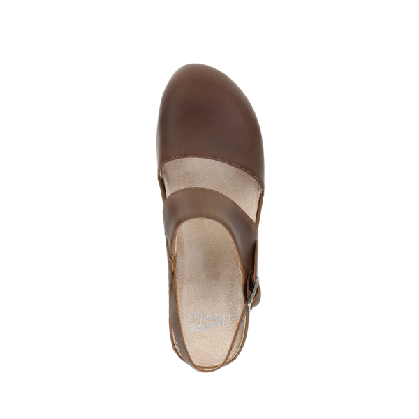 Top view of the Dansko Womens Lucia Tan by DANSKO, a Mary Jane-style clog with rounded closed toe and slingback strap, shown on a white background for a stylish and comfortable heeled look.