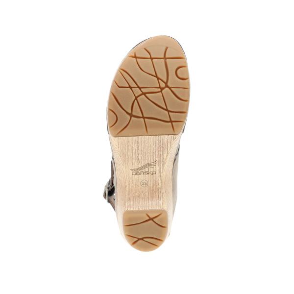 Bottom view of a Dansko Womens Lucia Taupe closed-toe clog sandal with a tan sole, wavy line pattern, small heel for comfort, and DANSKO brand name and logo on the sole.