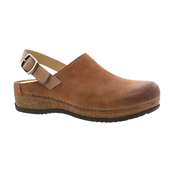 The Dansko Womens Merrin Tan by DANSKO is a brown suede sustainable leather mule with a closed toe, open heel, adjustable buckle strap, and cork-style sole with black tread for foot pain relief.