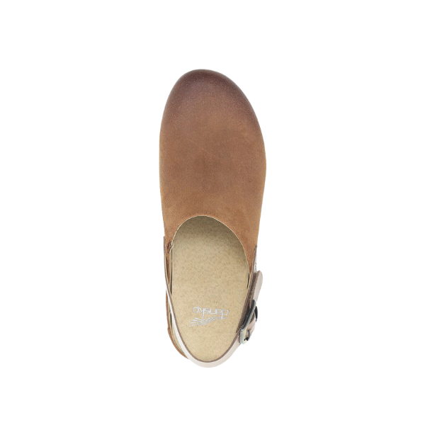 Top view of the Dansko Womens Merrin Tan sustainable leather mule by DANSKO, with closed toe, open back, and side buckle strap for foot pain relief, shown on a white background.