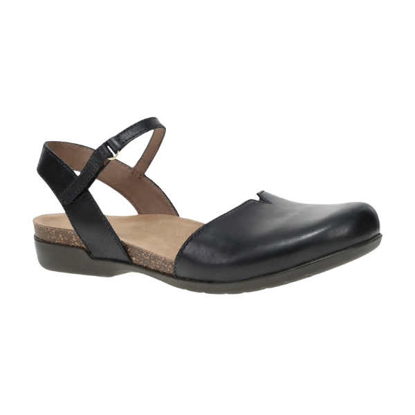 The Dansko Womens Rowan Black Waxy is a black leather flat from DANSKO, featuring a closed toe, adjustable ankle strap, cushioned tan insole for foot pain relief, and a low textured sole—an ideal alternative to casual sandals.