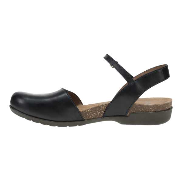 The Dansko Womens Rowan Black Waxy sandal by DANSKO features black leather, a closed toe, open heel, single strap, supportive cork-style insole for foot pain relief, and a low flat rubber sole for all-day comfort.