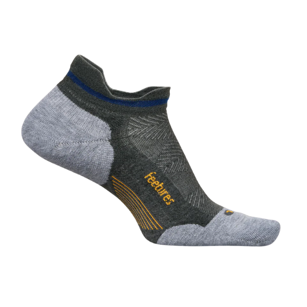 The FEETURES Elite Max Cushion Tab Grey/Grey sock features Max Cushioning, a light gray toe and heel, dark green accents, a blue stripe by the cuff, and feetures in yellow on the side.