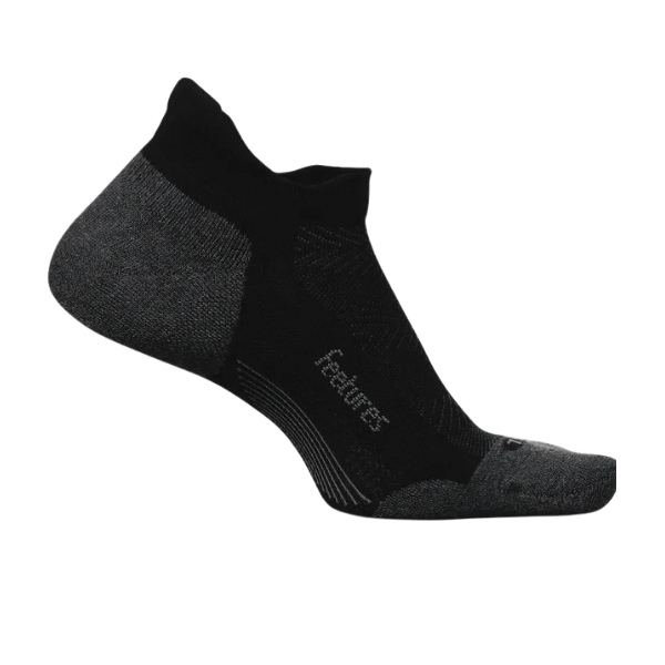 The FEETURES Unisex Elite Light Cushion No Show Tab Black sock features a low-cut design in black and dark gray with reinforced heel and toe, moisture-wicking breathable fabric, targeted compression, and FEETURES knitted on the side.
