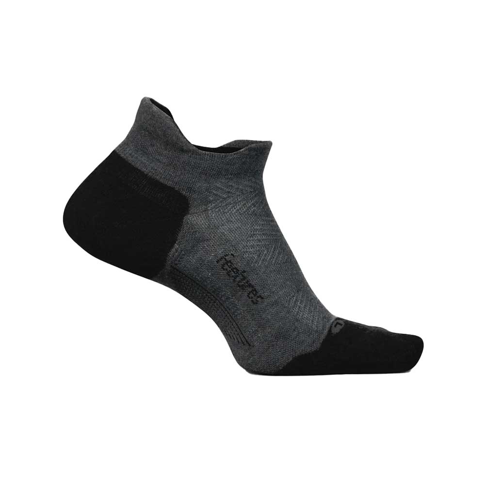The FEETURES Feetures Unisex Elite Max Cushion No Show Tab Grey sock is a low-cut, dark gray and black athletic sock with reinforced fabric and Elite Max Cushion in the heel, arch, and toe. Subtle pattern details are visible on a white background.