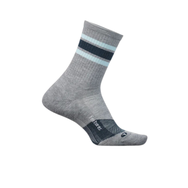 The FEETURES Unisex Trail Max Cushion Mini Crew Grey sock features light gray fabric, two blue stripes near the top, subtle branding on the foot, and a max cushion design for comfort. Displayed against a white background.