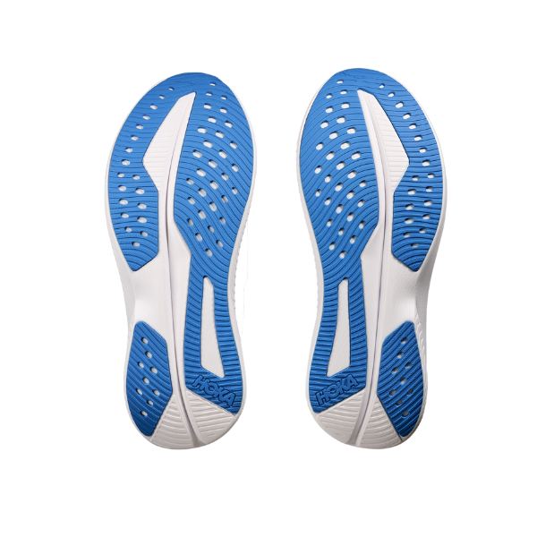 Two athletic shoe soles in blue and white with ventilation holes and textured grip, ideal for Everyday Running. The HOKA logo appears on the heel, identifying them as HOKA Mens Mach 6 Wide Blue soles.