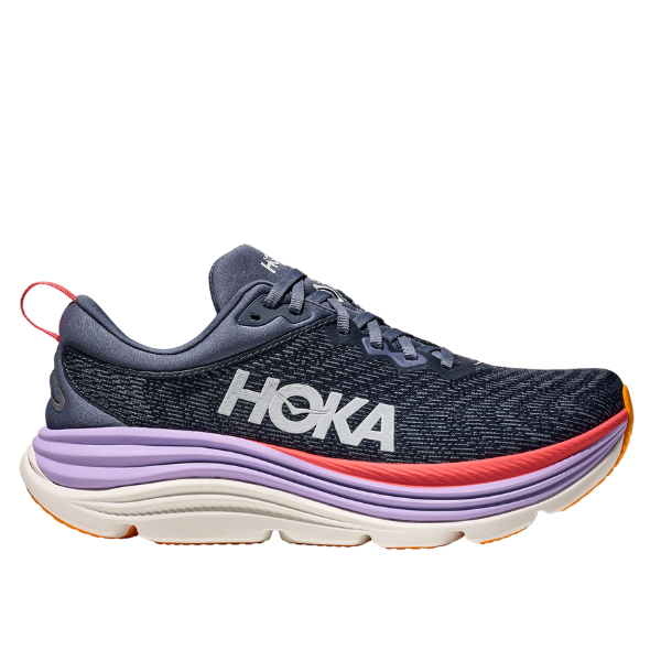 The HOKA Womens Gaviota 5 Wide in Anchor/Grapefruit is a navy running shoe with a white HOKA logo, purple and white sole, orange outsole accents, red heel pull tab, and Stabilizing H-Frame technology for support.