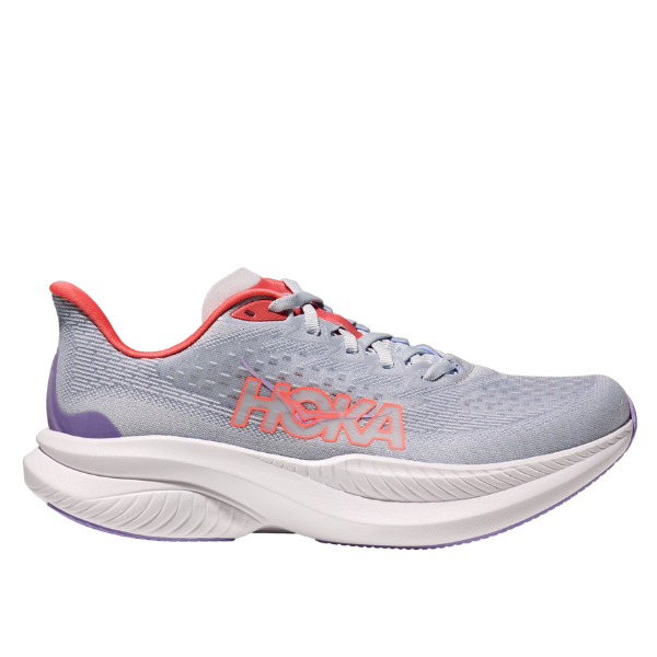 The HOKA Womens Mach 6 Wide in grey and orange features a thick white sole and supportive design, perfect for everyday running or those with plantar fasciitis. Shown from the side on a white background.