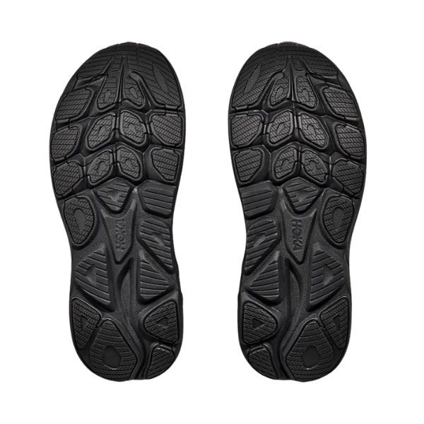 Black shoe sole with tread pattern on a white background