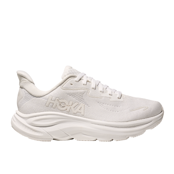 The HOKA Womens Clifton 10 White features a thick cushioned sole, mesh upper, and white laces for plush performance. The streamlined design includes the Hoka Clifton 10 name on the side, blending comfort with modern athletic style.
