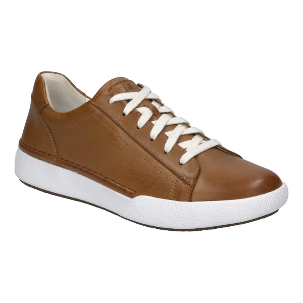 The Josef Seibel Womens Claire 01 Camel is a brown leather comfort sneaker with white laces and a thick sole, shown angled to display the outer side and front—ideal for women seeking all-day foot pain relief.
