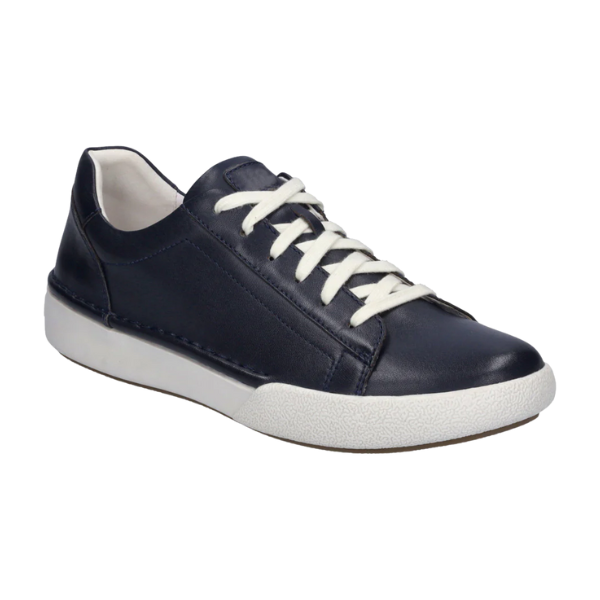 The Josef Seibel Womens Claire 01 Indigo sneaker features navy blue leather, white laces, a cushioned sole, and low-top design for stylish comfort and foot pain relief. Brand: Josef Seibel. Displayed on a plain white background.