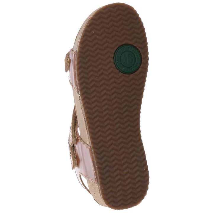 The image shows the bottom view of the Josef Seibel Womens Tonga Camel sandal with a brown, textured rubber sole and a round Josef Seibel logo near the heel. Pink adjustable straps are visible on the sides for style and support.
