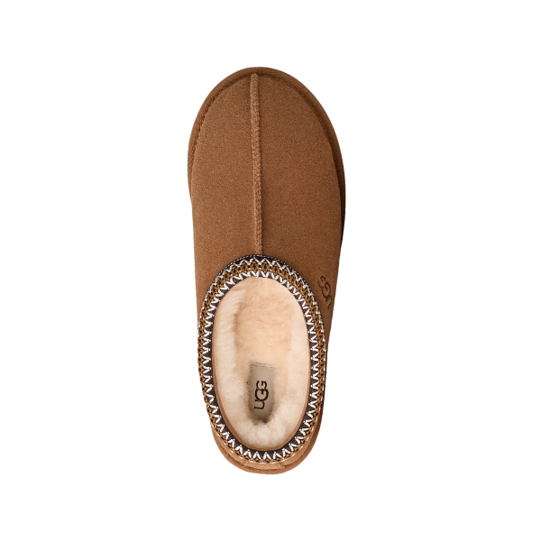 A single UGG Men's Tasman II Chestnut slipper, seen from above, showcases a soft sheepskin lining and decorative stitching around the suede upper opening.