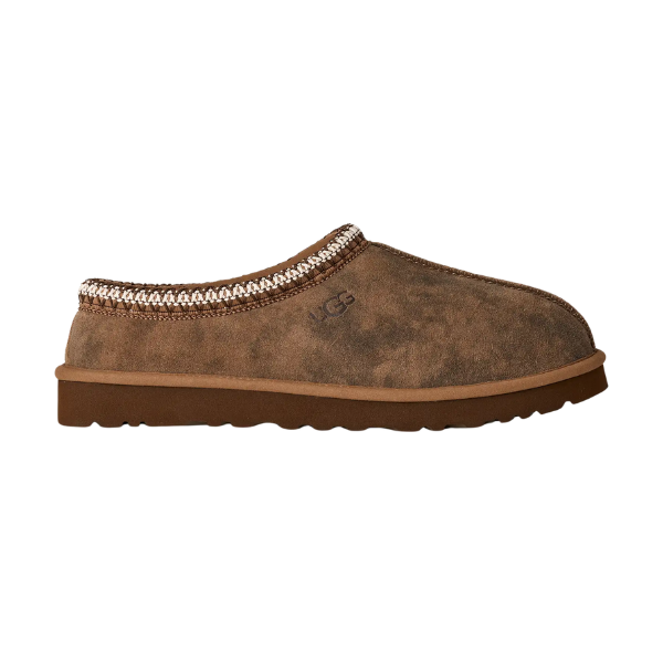 The UGG Men's Tasman Baxter Chestnut features a brown suede upper, decorative ankle trim, low back, UGGplush lining, and a flat rubber sole.