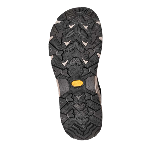 The image shows the TEVA Women's Grandview Max GORE-TEX Black hiking boot's rubber sole, with a rugged textured tread and yellow Vibram logo, photographed against a white background.