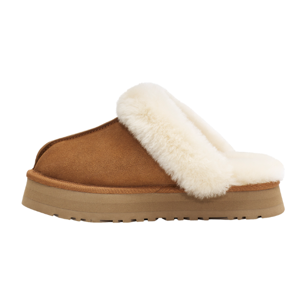 The UGG Women's Disquette Chestnut is a tan suede platform slipper with plush white lining and a sturdy rubber sole, displayed in side profile on a white background.