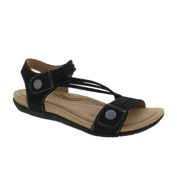 The Biza Womens Luna Midnight by BIZA FOOTWEAR is a black open-toe walking sandal with crisscross straps, adjustable Velcro, silver button accents, a cushioned tan footbed, and a slightly raised sole for stylish all-day comfort.