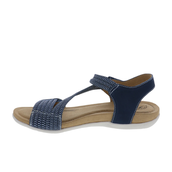 The Biza Womens Luna Navy by BIZA FOOTWEAR is a navy blue open-toe sandal with white stitching, a flat beige sole, an ankle strap with velcro closure, and a woven front strap designed for stylish comfort and foot pain relief.