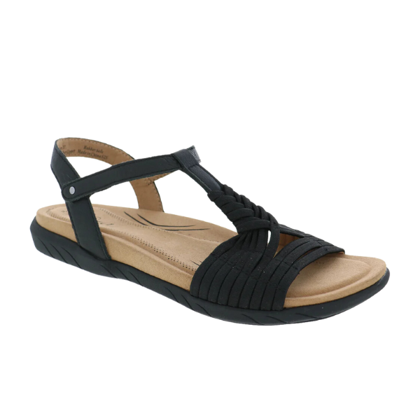 The Biza Womens Kate Black by BIZA FOOTWEAR is a black strappy sandal with a tan memory foam footbed, open toe, low black sole, braided front design, and an adjustable Velcro ankle strap for personalized comfort.