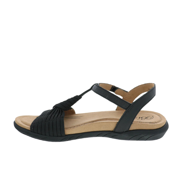 The Biza Womens Kate Black by BIZA FOOTWEAR is a comfort sandal with a low wedge heel, memory foam footbed, cushioned tan insole, and adjustable Velcro strap, shown from the side on a white background.