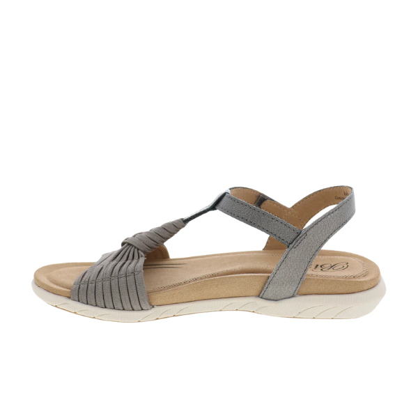 The BIZA FOOTWEAR Biza Womens Kate Bronze sandal features a bronze finish, low beige cushioned sole, adjustable Velcro back strap, pleated front detailing, open toe and heel, plus a memory foam footbed for superior comfort.