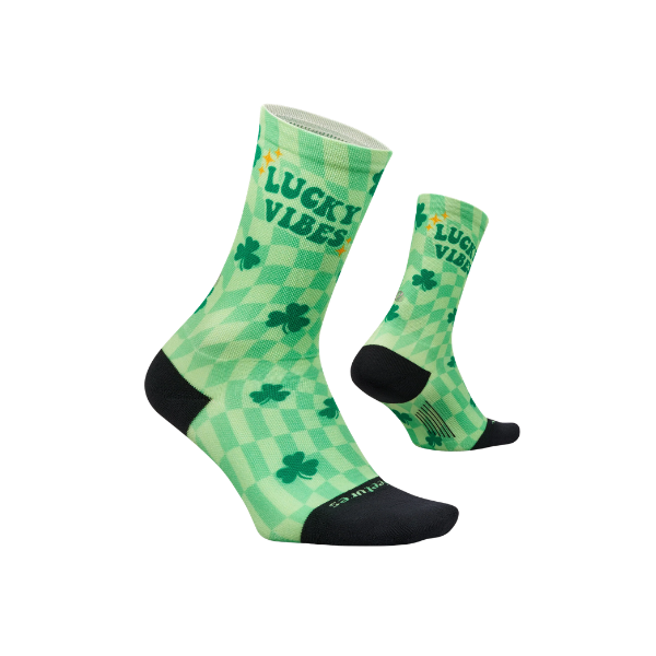 FEETURES Elite Light Cushion Mini Crew "Lucky Vibes" socks: green checkered, shamrocks, black toes/heels.