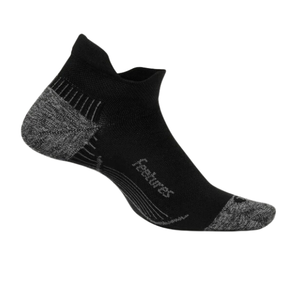 The FEETURES Plantar Fasciitis Relief Light Cushion No Show Sock in black features reinforced toe and heel, targeted compression for plantar fasciitis relief, and is shown on a white background with Feetures printed by the instep.
