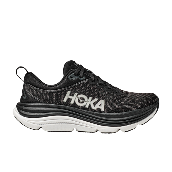 The HOKA Womens Gaviota 5 (Medium) in Black/White features a thick white and black sole, lace-up closure, stabilizing H-Frame for support and pain relief, and a white HOKA logo on the side. Shown in profile on a white background.