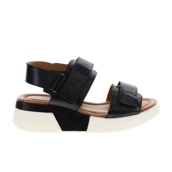 The SOVELLA Womens Maya Black sandal offers adjustable straps, a cushioned insole for comfort and foot pain relief, and a stylish thick black-and-white sole—ideal for casual wear.