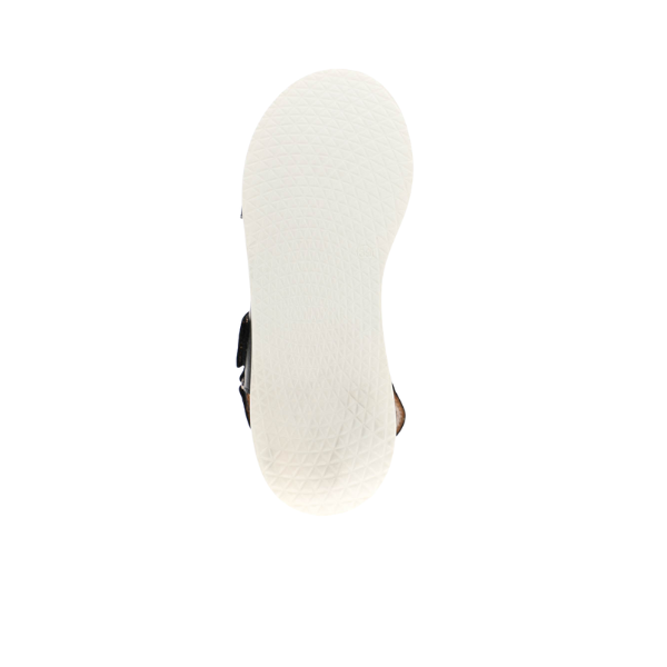 A top-down view of the Sovella Womens Maya Black Sandal by SOVELLA shows its white, subtly textured sole and cushioned insole for foot pain relief, all set against a plain white background.