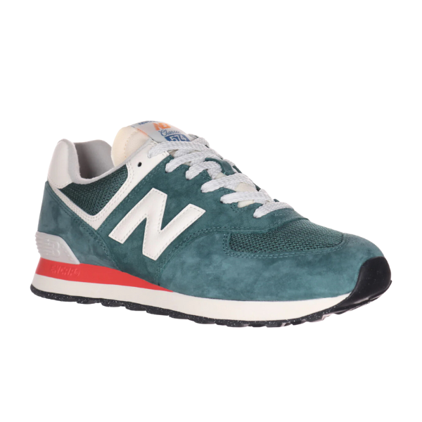 The New Balance Unisex 574 New Spruce/Sea Salt sneaker features teal mesh, white laces, a white N logo, gray accents, a red stripe above the black sole—offering comfort and support to help reduce foot pain.