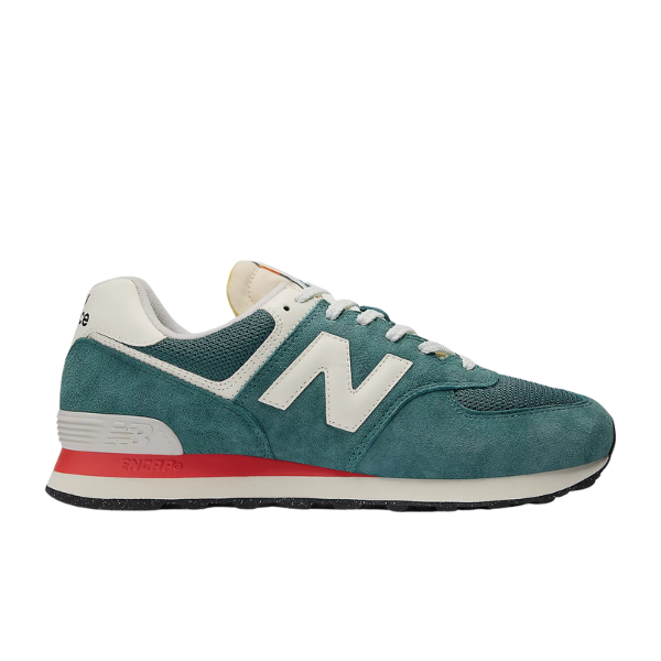 The New Balance Unisexs 574 in New Spruce/Sea Salt features a teal and white suede and mesh upper, white laces, a large N logo, black outsole, and red midsole accent.
