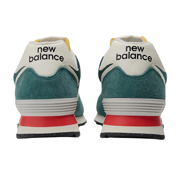 Back view of two New Balance Unisexs 574 New Spruce/Sea Salt shoes, teal and white with red accents and black soles, side by side displaying the NEW BALANCE logo on the heels. Ideal for easing foot pain during daily routines.
