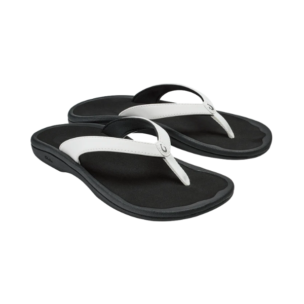 OLUKAI Women’s Ohana Lahi sandals in White Sand/Black with fabric straps and contoured footbeds on white background.
