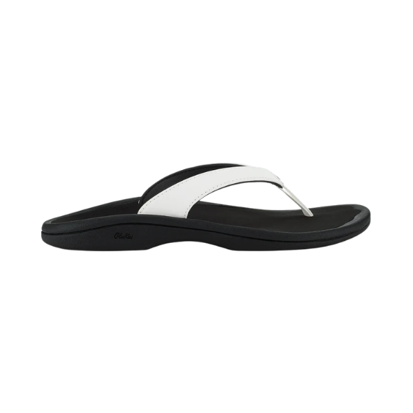 OLUKAI Women’s Ohana Lahi White Sand/Black sandal with contoured footbed, side view on white background.