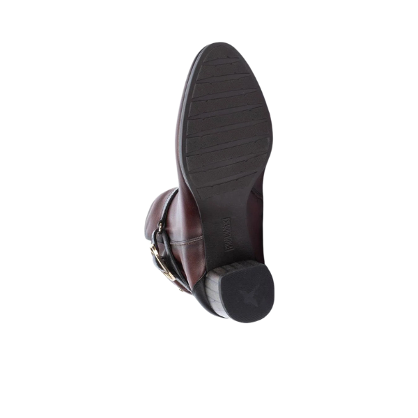 A PIKOLINOS Pikolino Women’s Calafat Dark Brown leather dress shoe is shown from the bottom, highlighting its textured sole and small heel, against a white background.