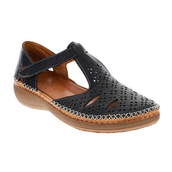 The Sovella Womens Sabrina Black by SOVELLA is a black leather women’s casual shoe with a T-strap, perforated upper, brown cushioned sole, and stitched edge detailing for all-day comfort.