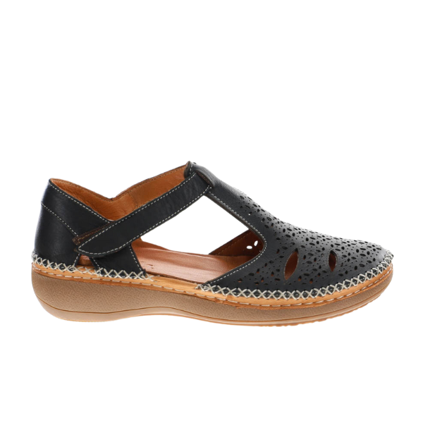 The SOVELLA Womens Sabrina Black sandal features black leather, closed-toe cutout design, Velcro strap, tan cushioned sole, and decorative stitching—delivering all-day comfort and style.