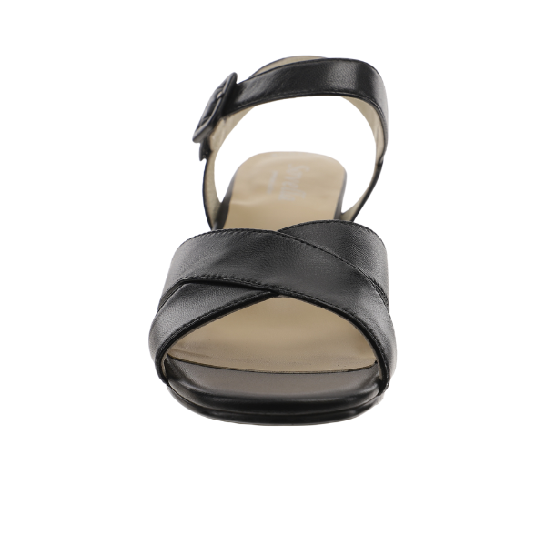 The Sovella Womens Celine Sandal Black by SOVELLA features crisscross premium leather toe straps, an adjustable ankle buckle, and a cushioned footbed—shown from the front against a white background.