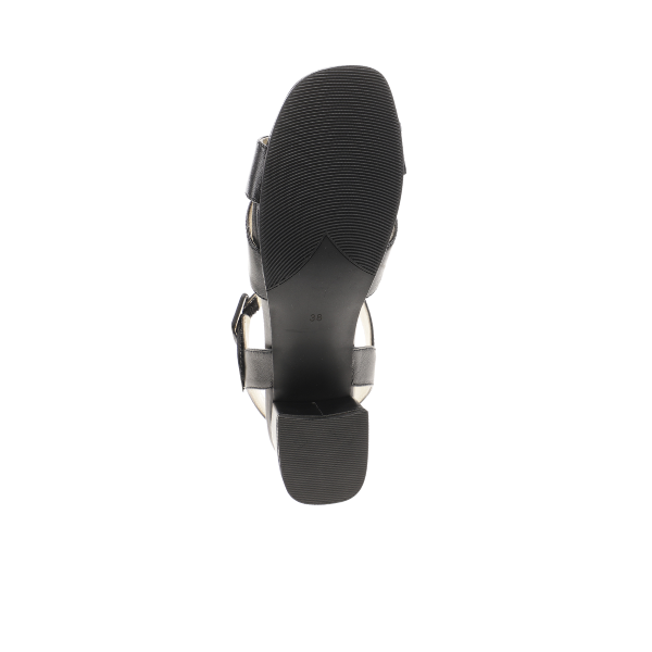 The image shows the bottom view of the Sovella Womens Celine Sandal Black by SOVELLA, crafted from premium leather with a textured sole, rectangular heel, visible buckle strap, cushioned footbed, and 38 printed on the sole.