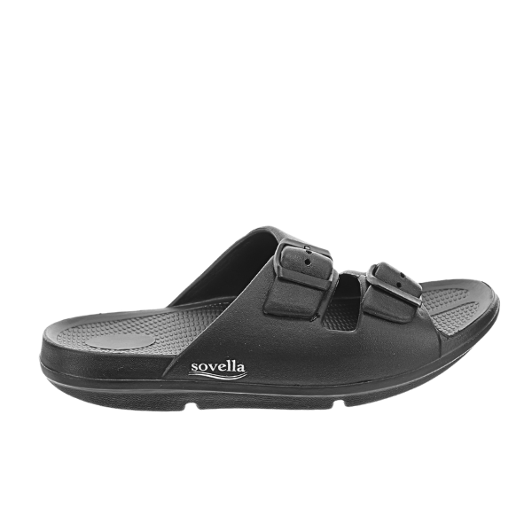 The SOVELLA Womens Buckle Slide Black sandal features two adjustable straps, a textured footbed with arch support, and a water-friendly design. Sovella is printed in white on the sole, displayed from a side view against a white background.