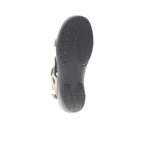 The image shows the bottom view of the Fidelio Womens Liberty Beige sandal with a black textured rubber sole, partially visible beige upper, and the FIDELIO brand name embossed in the center.