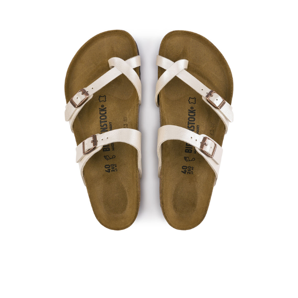 A pair of BIRKENSTOCK Womens Mayari Birko-Flor Graceful White Pearl sandals with crisscross straps and buckles, featuring a contoured footbed, shown from above on a white background.