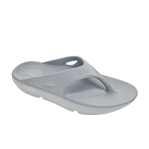 The Sovella Womens PF Thong Light Grey sandal by SOVELLA features a textured footbed and Wide ergonomic strap, offering flip-flop style with superior arch support and all-day comfort recovery.
