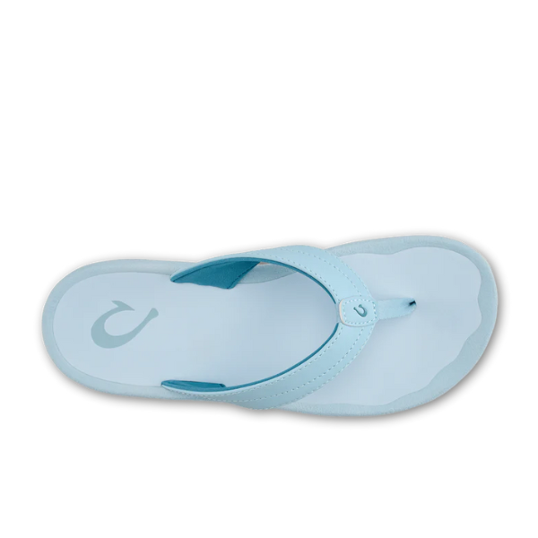 The OLUKAI Womens Ohana Misty Blue sandal features a comfort footbed and Wide thong strap with a small logo, shown from above—perfect water-resistant sandals for everyday wear.