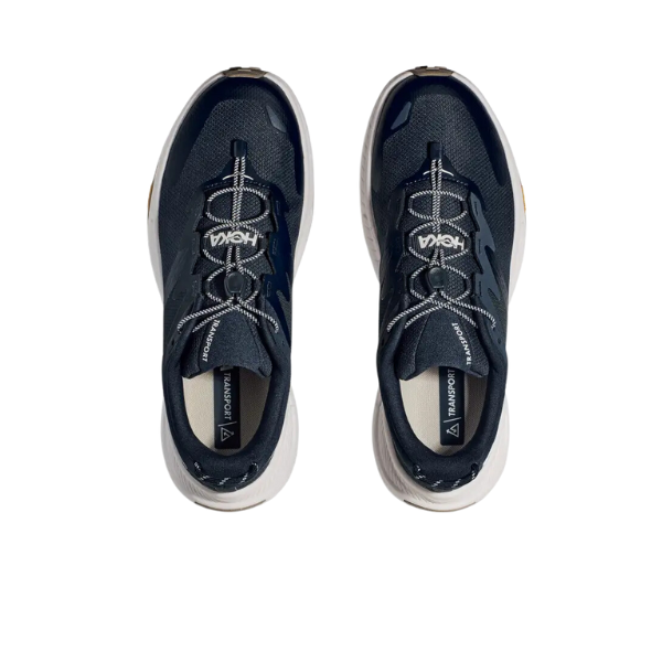 Top view of HOKA Mens Transport Wide running shoes in navy, featuring white soles, detailed stitching, branded insoles, crafted from vegan materials, and displayed on a white background.