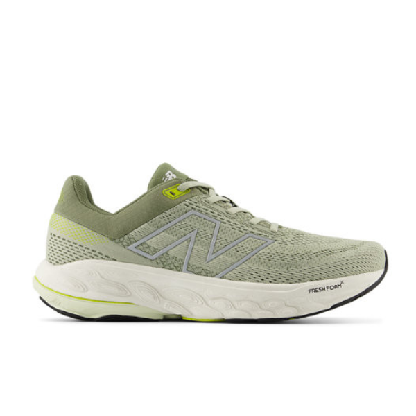 The New Balance Mens Fresh Foam 860v14 Green features a light green mesh upper with white and silver accents, lace-up closure, a cushioned Fresh Foam sole, Stability Plane tech, and a black outsole.