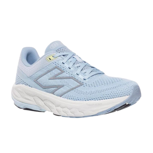 The New Balance Womens Fresh Foam 860v14 Blue/White stability running shoe features a light blue mesh upper, lace-up closure, white cushioned sole, and dark blue zigzag side design, shown against a plain white background.
